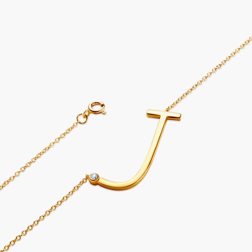 Naszyjnik celebrytka litera J Savicki: srebrny pozłacany, biały szafir